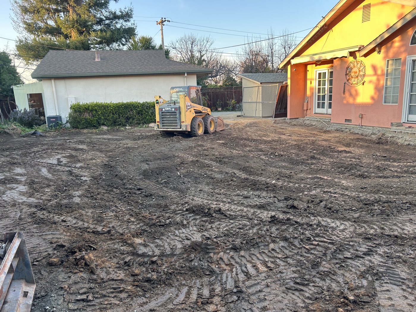 Backfilled yard being graded and leveled