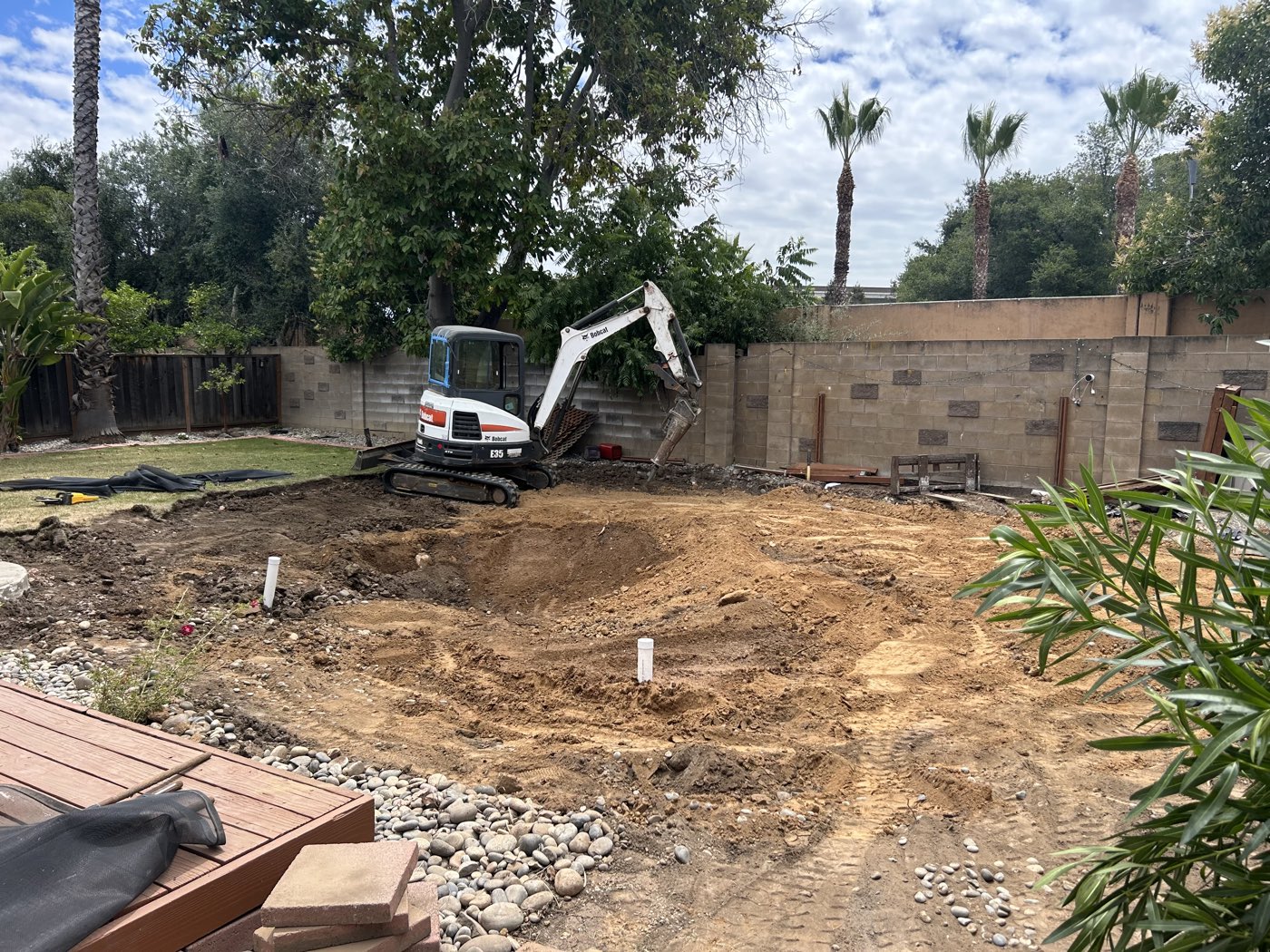 Deep pool excavation cavity with clean dirt walls before backfill